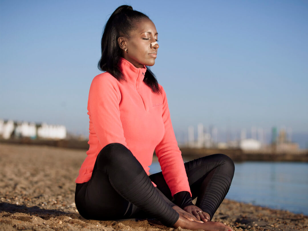black-woman-meditating-on-the-beach