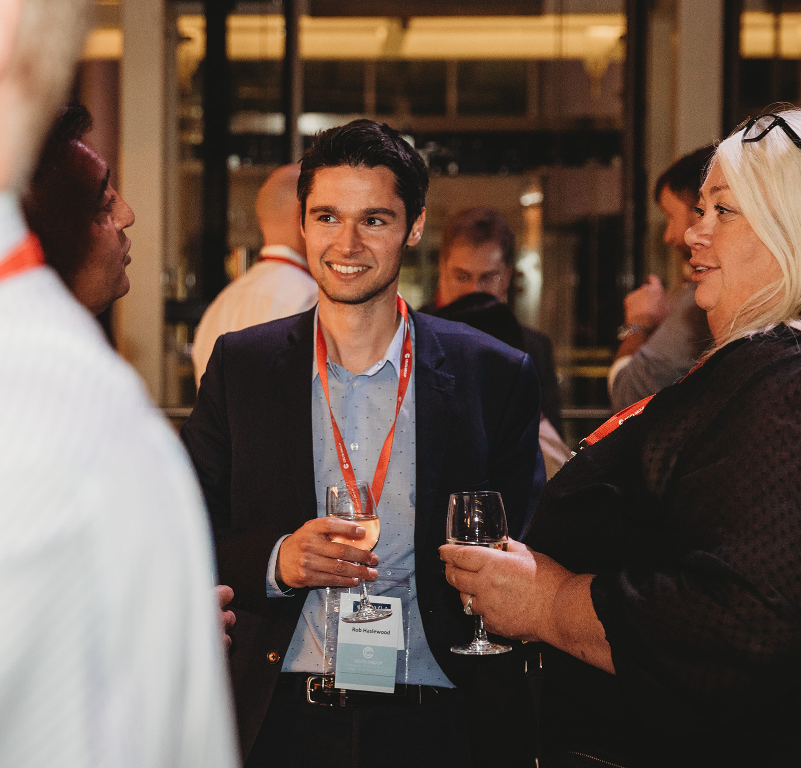 A group of people in business attire network at the Ceuta International Conference