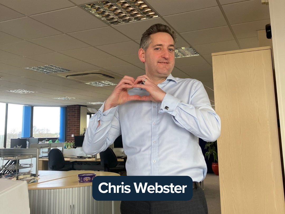 Chris Webster making a heart with his hands