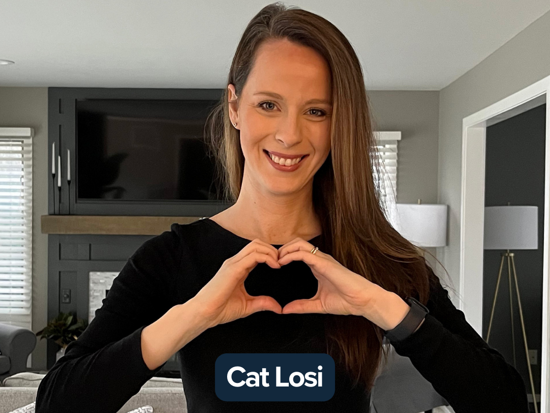 Cat Losi making a heart with her hands