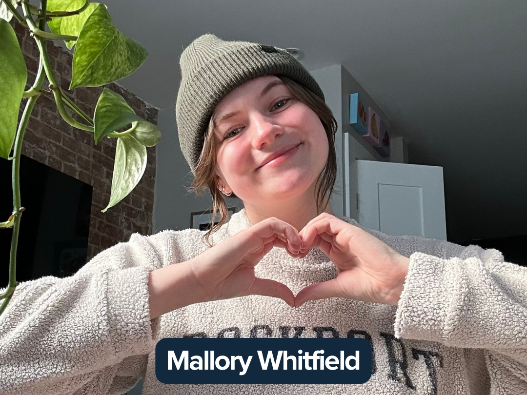 Mallory Whitfield making a heart with her hands