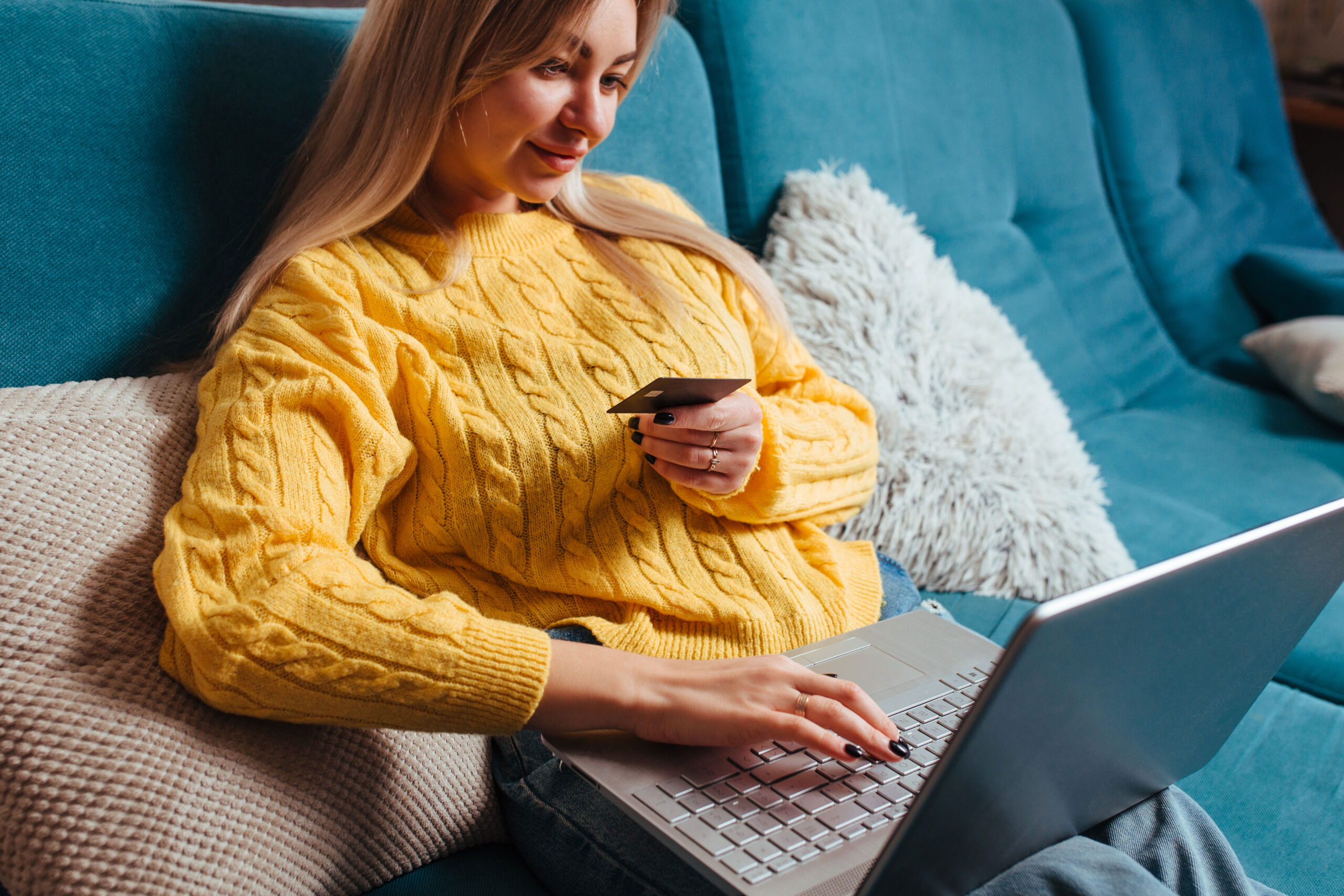 a-woman-with-a-laptop-in-a-yellow-sweater-sits-on-2023-11-27-04-55-34-utc-1